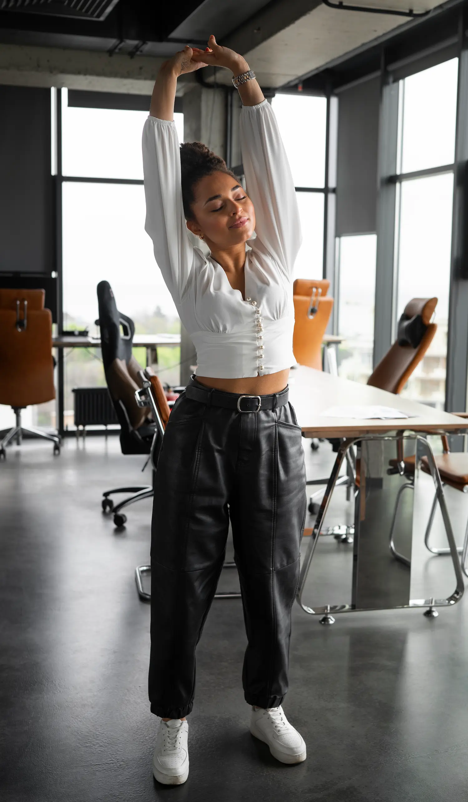 Simple stretch performed while taking an eye break at a desk.