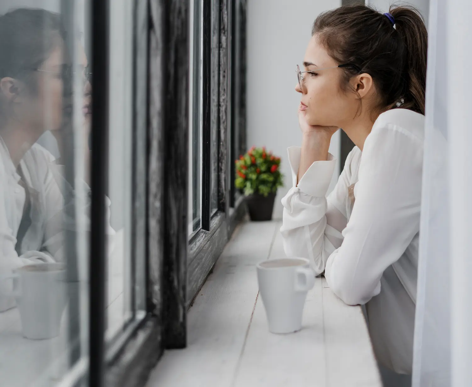 Remote worker gazing out the window to rest their eyes.