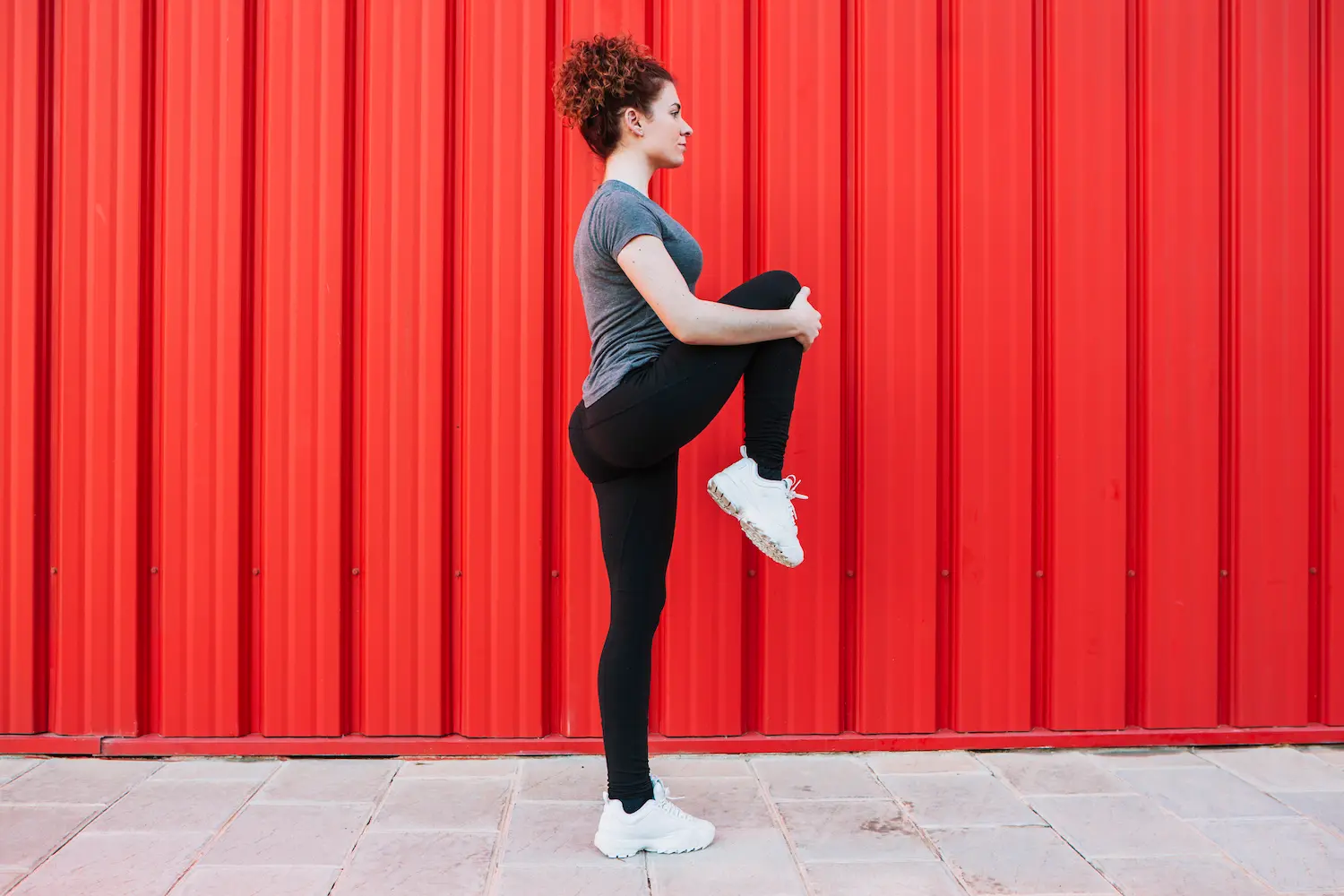 A standing core move that mimics slow high knees.