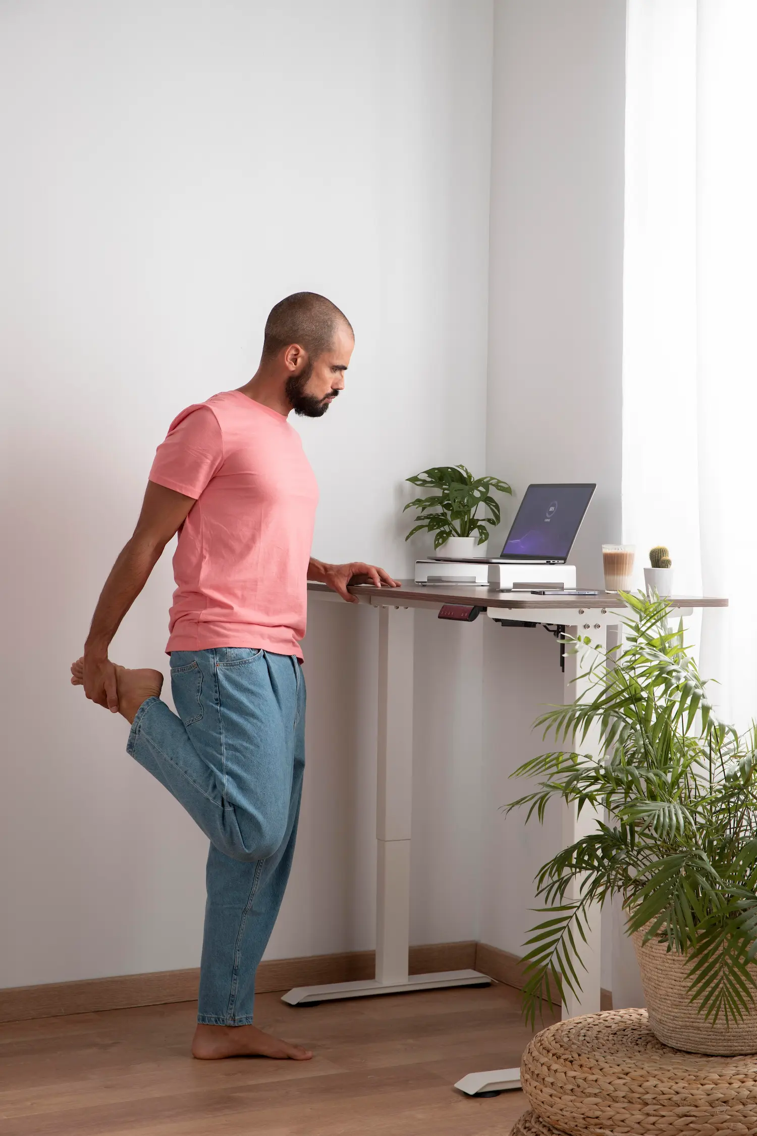 Man stretching by his desk